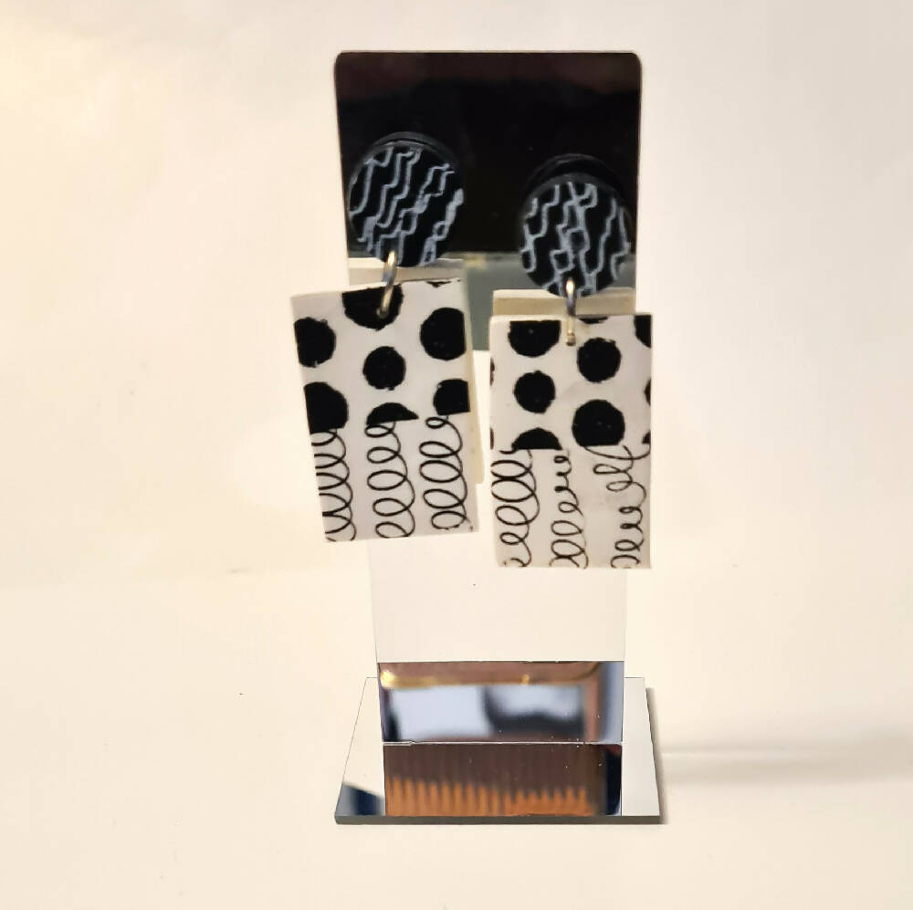 Black and white stud earrings