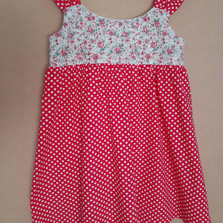 Cute size 5 child's dresses. One-Of-A-Kind Print Bodice with Contrasting Spots. Available in 2 colours.